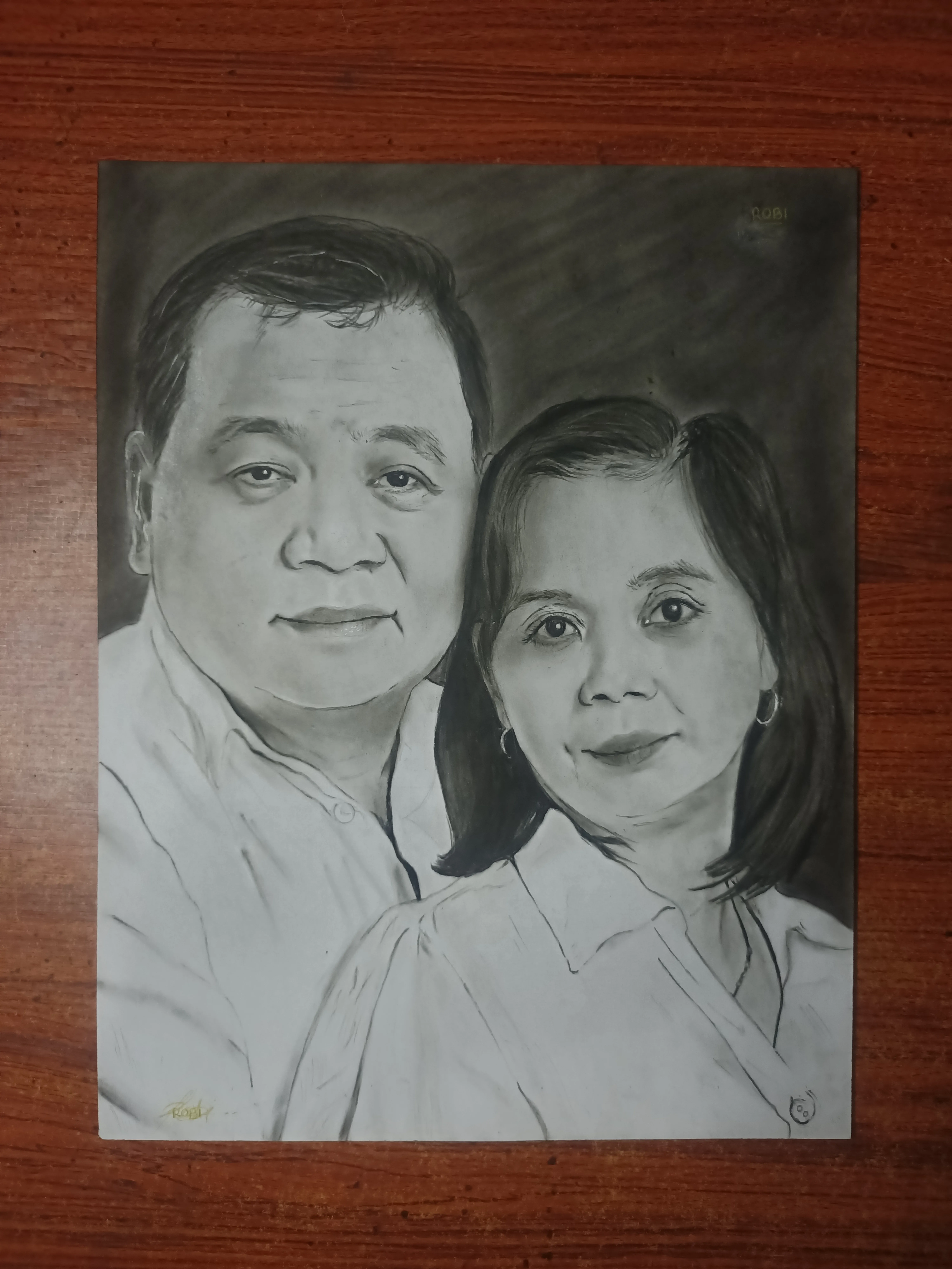 Charcoal pencil couple portrait of the Betiong family, by TOPEH — commissioned hand-drawn artwork